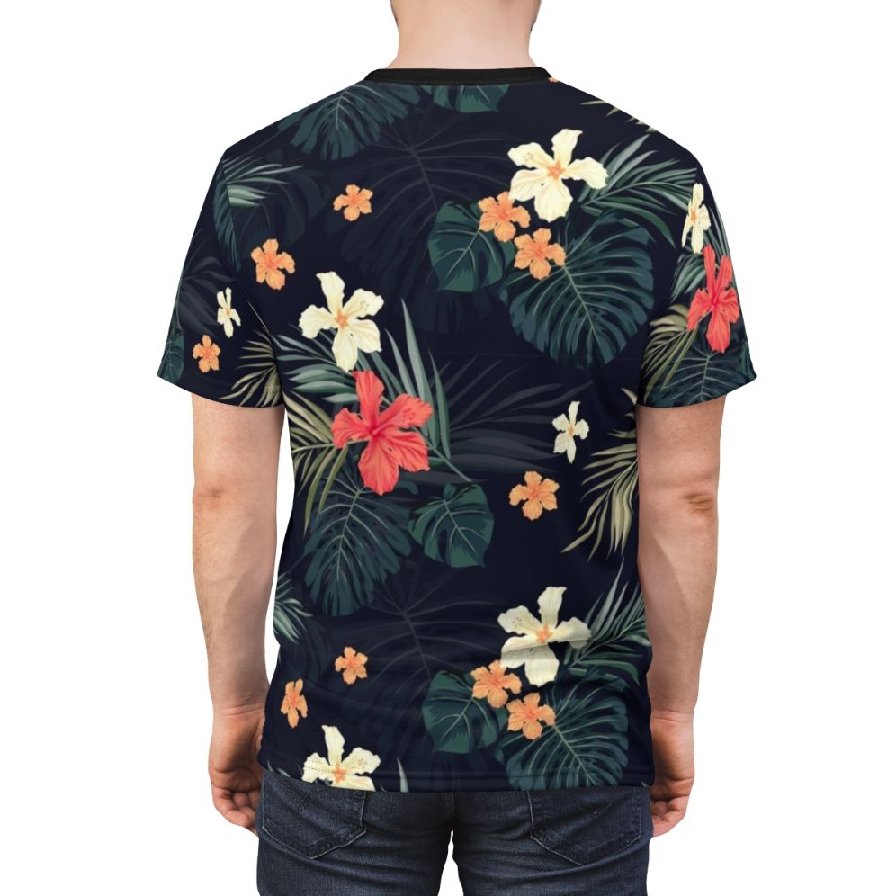 Model wearing a dark t-shirt featuring a tropical floral pattern design. - men back