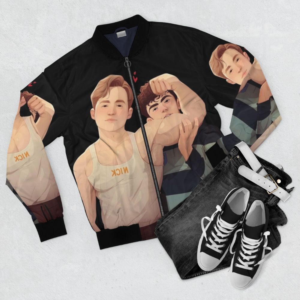 Bomber jacket featuring a romantic illustration of the gay couple Nick and Charlie from the Heartstopper book and Netflix series. - Flat lay