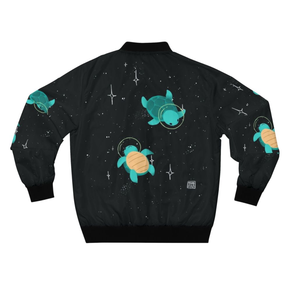 Space turtle bomber jacket with a cute, green turtle design against a starry, galaxy background. - Back