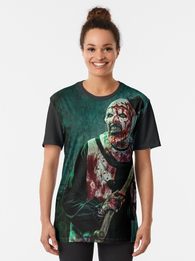 Terrifier 2 horror movie graphic t-shirt featuring Art the Clown, a terrifying clown character from the Terrifier film series. - Women