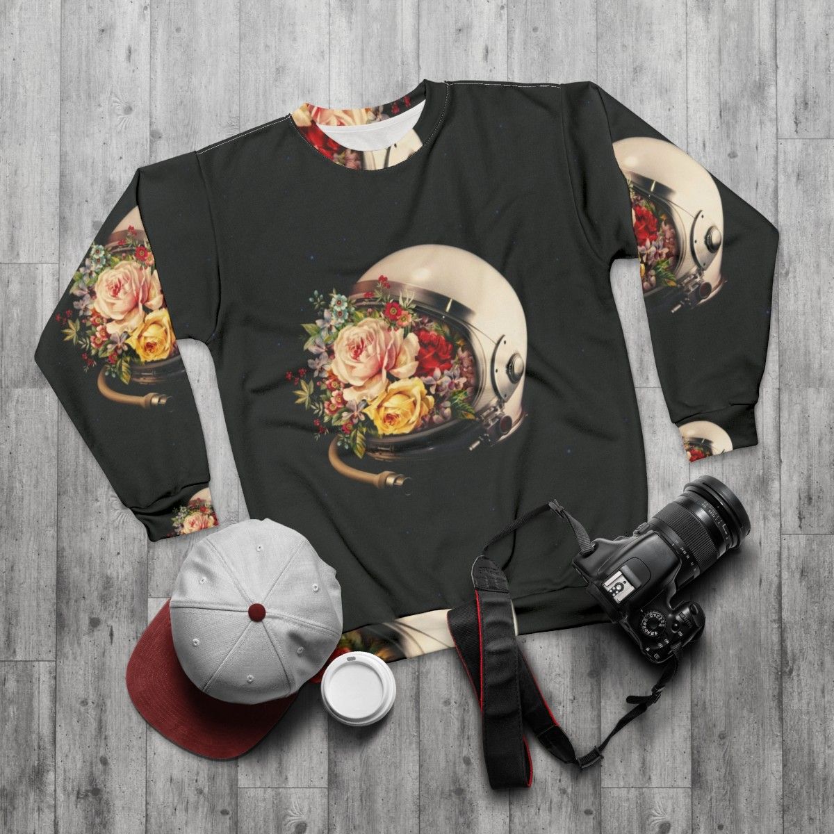 Celestial Bloom Astronaut Sweatshirt featuring a surreal collage of an astronaut, stars, and flowers - flat lay