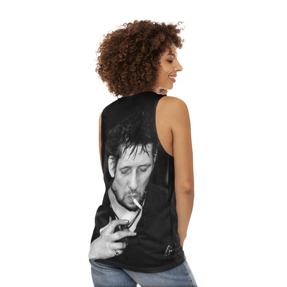 Shane Macgowan, lead singer of The Pogues, smoking in black and white portrait - women back