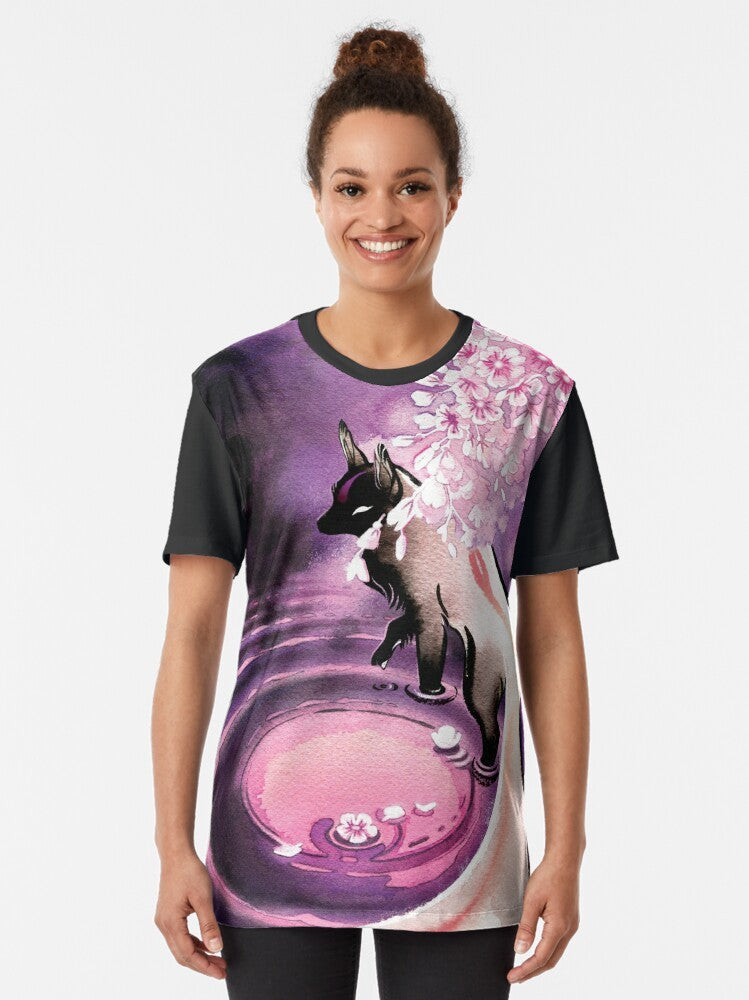 Graphic tee featuring a mystical fox surrounded by cherry blossoms under a rose moon - Women