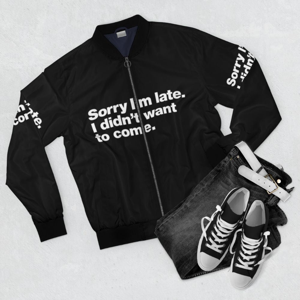 Bomber jacket with text 'Sorry I'm late. I didn't want to come.' - Flat lay