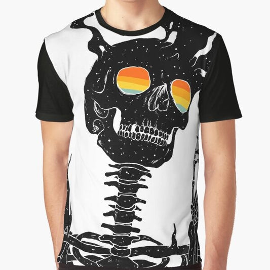 A graphic t-shirt design featuring a surreal, cosmic skull and skeleton against a background of stars, moon, and rainbow-colored space.