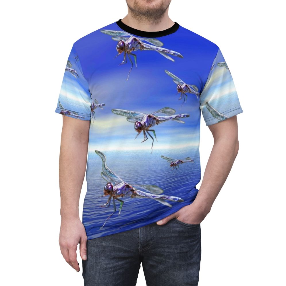 Model wearing a colorful t-shirt with a vibrant dragonfly and abstract pattern design - men front