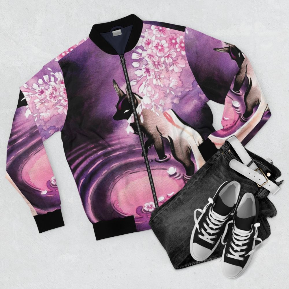 A rose moon-inspired bomber jacket featuring a sakura blossom and fox design - Flat lay