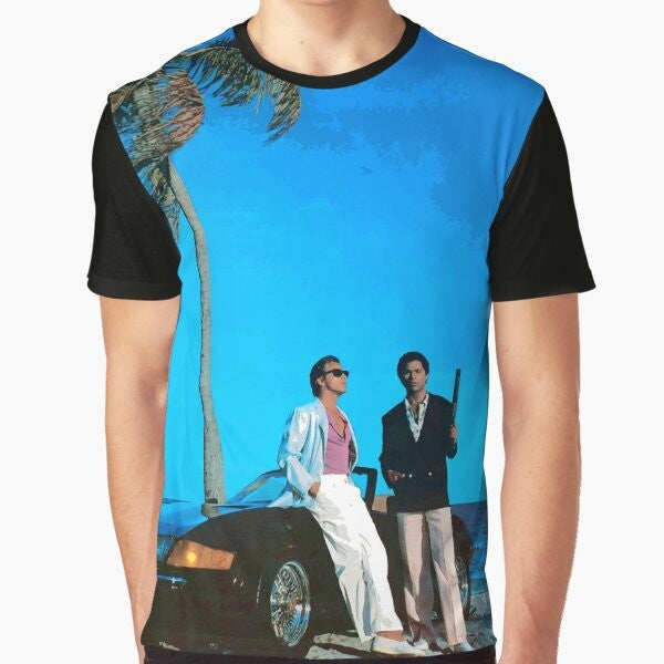 Retro Miami Vice inspired t-shirt featuring a blue graphic design with the words "Miami Vice" and characters Crockett and Tubbs from the 1980s TV series.