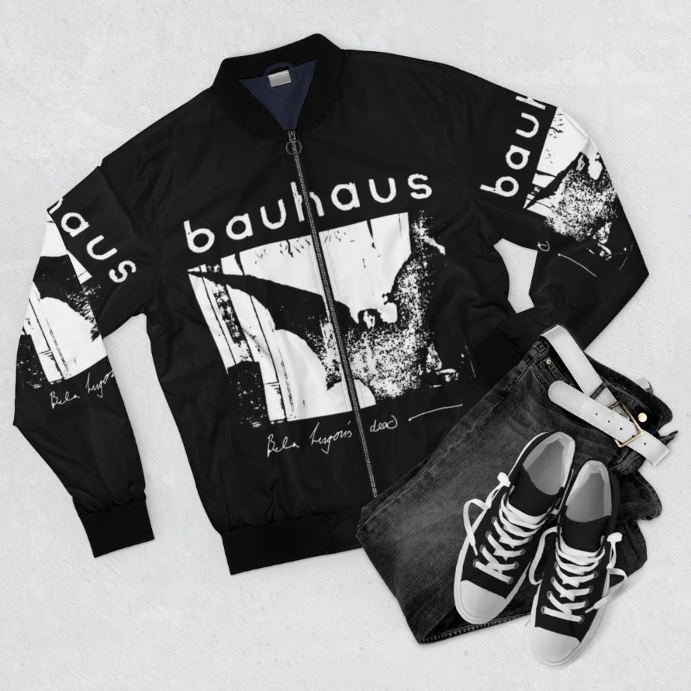 Bauhaus inspired bomber jacket with bat wing design and "Bela Lugosi's Dead" text - Flat lay