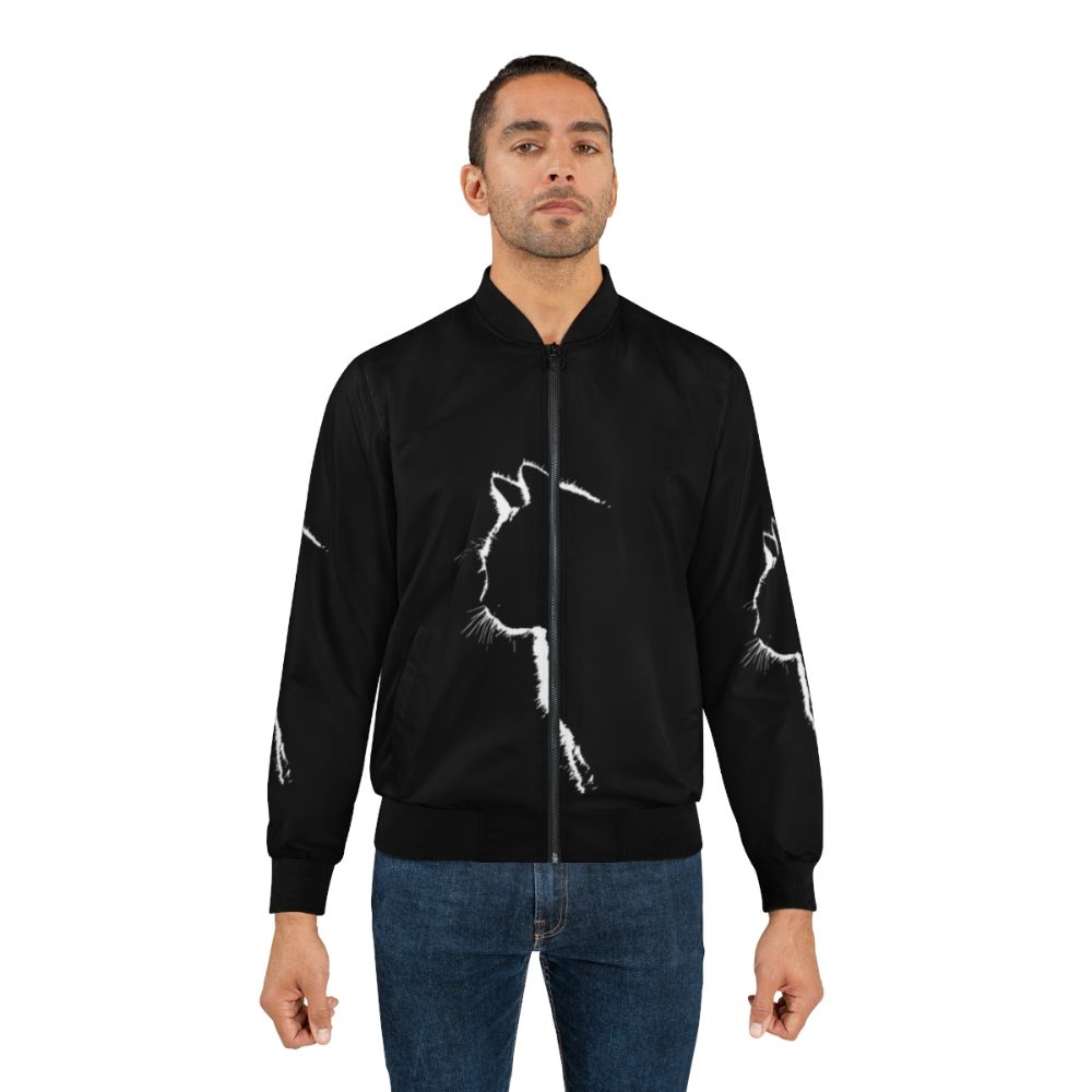 A stylish bomber jacket featuring a minimalist cat silhouette design in black and white. - Lifestyle