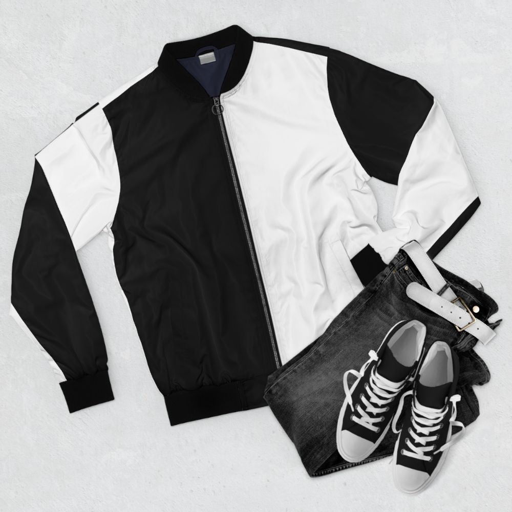 Split black and white bomber jacket with contrasting panels - Flat lay