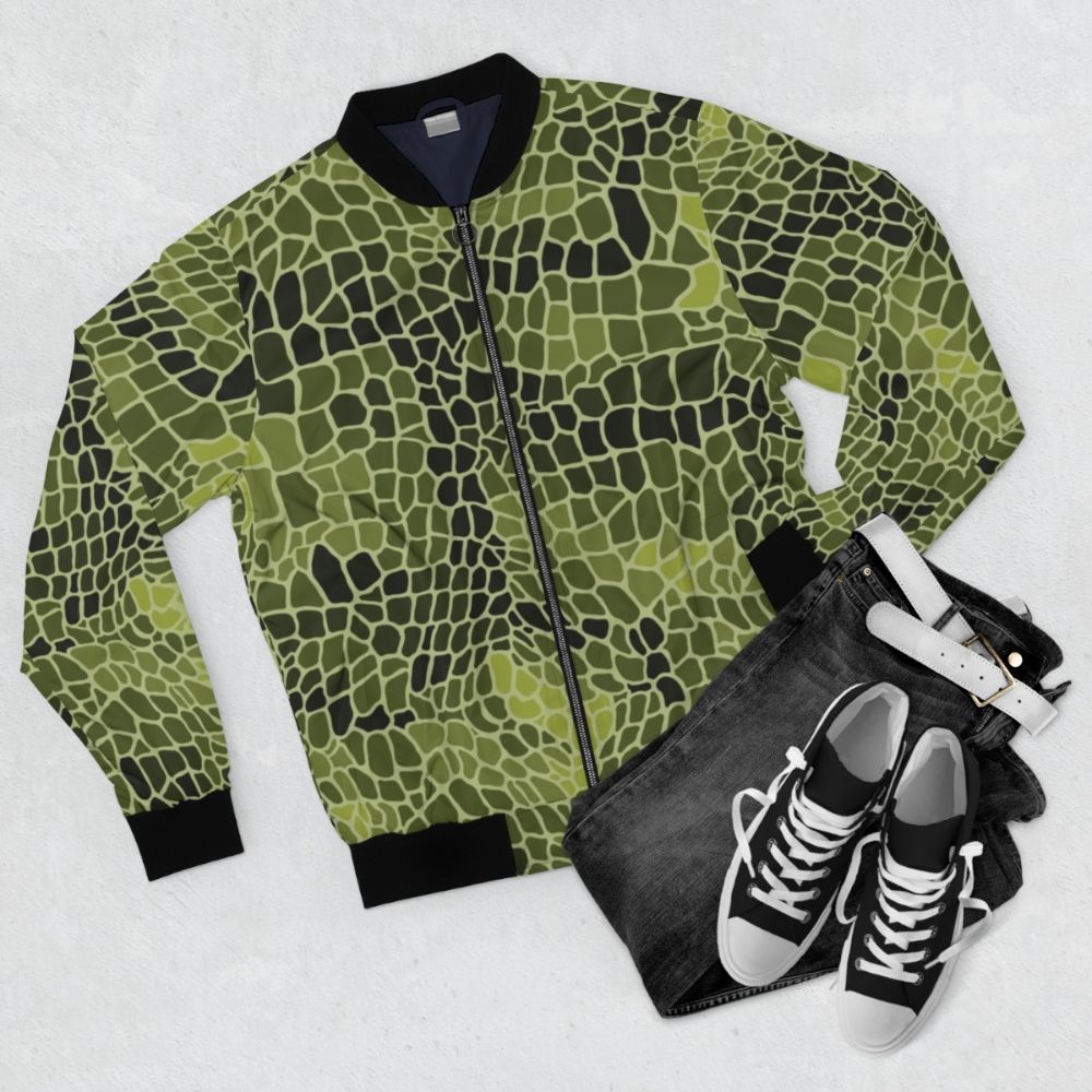 Alligator skin bomber jacket with green, textured animal pattern - Flat lay