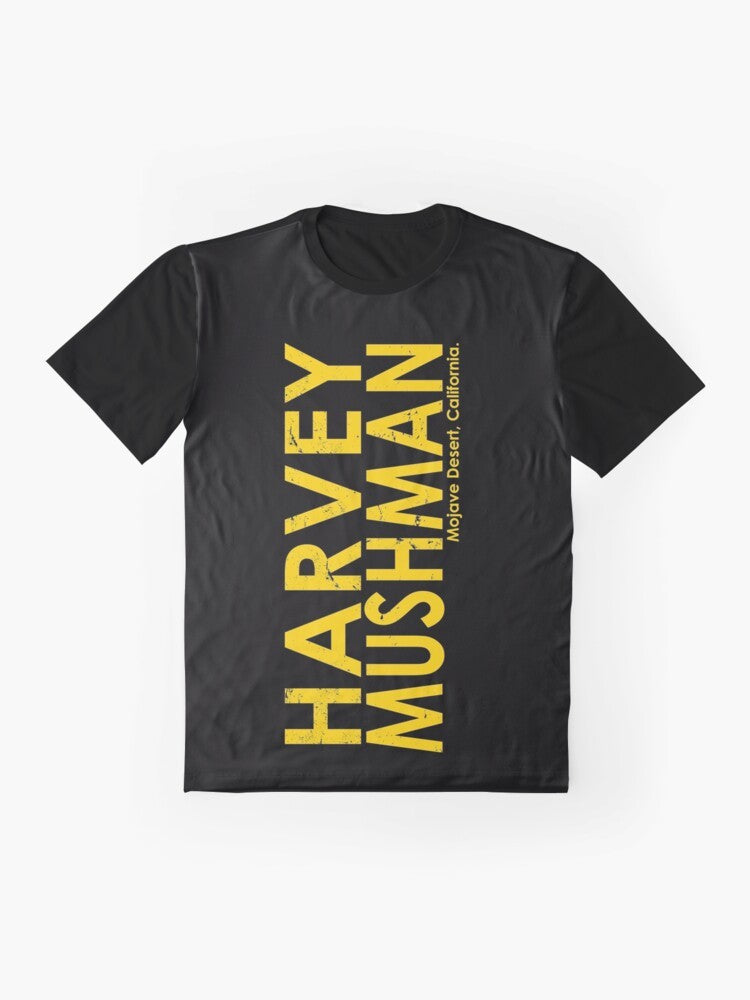 Vintage-style graphic t-shirt featuring the "Harvey Mushman" design, with a classic motorcycle and desert racing theme. - Flat lay