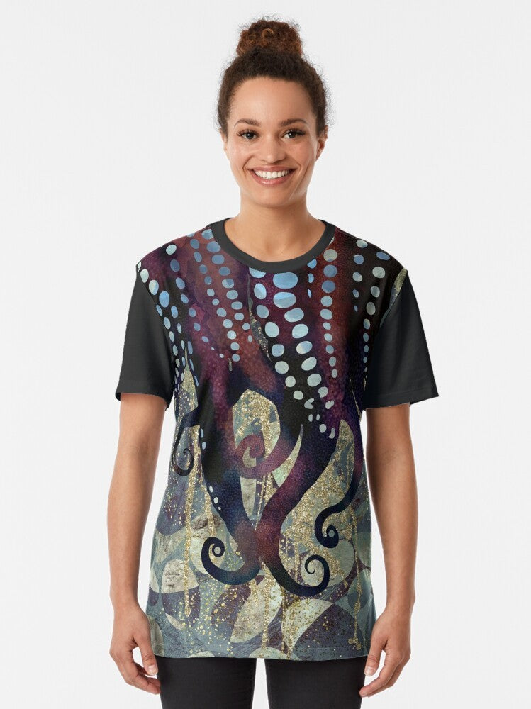 Metallic ocean graphic t-shirt with an abstract nature design featuring underwater elements in shades of blue, purple, and gold. - Women