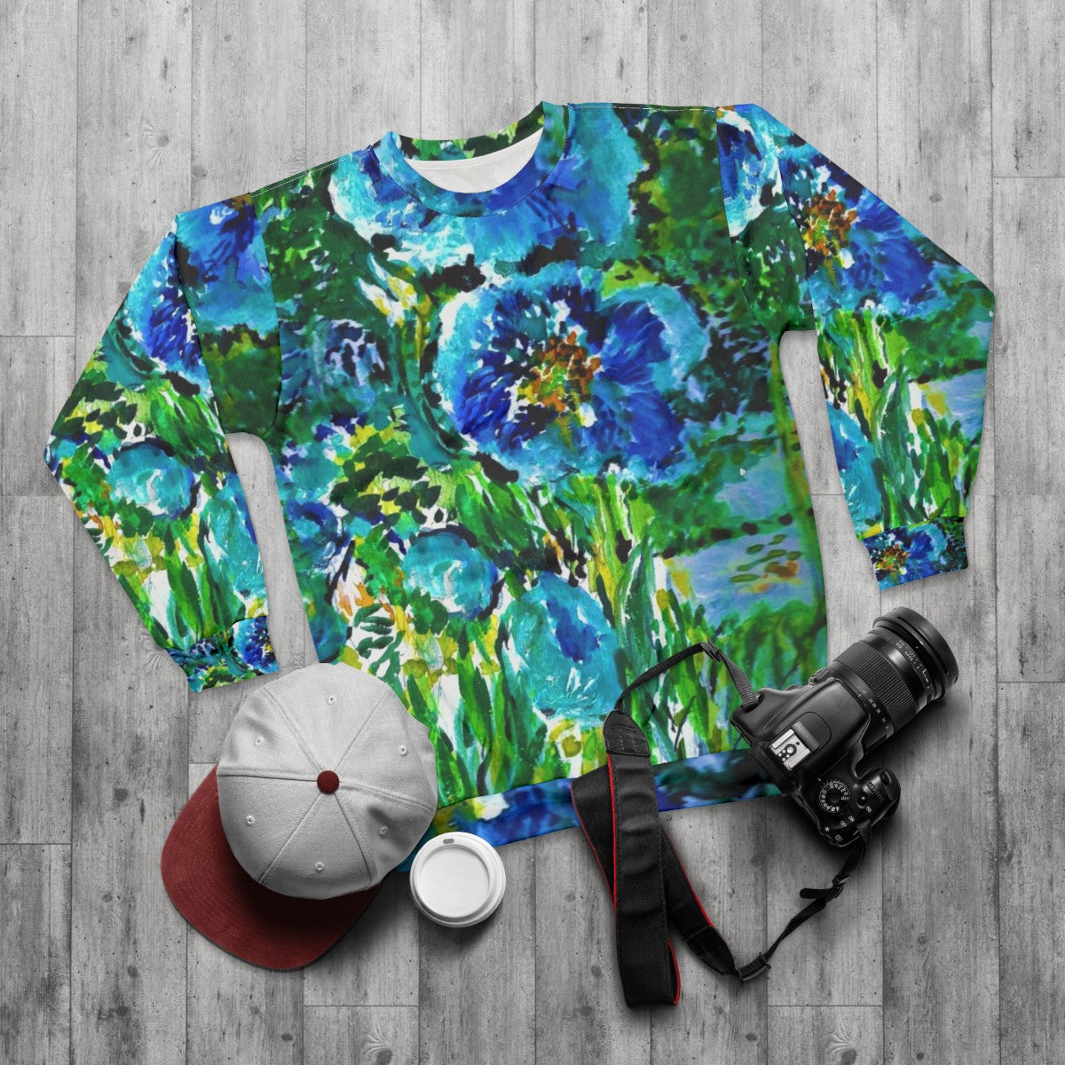 Blue poppies sweatshirt with religious art design - flat lay