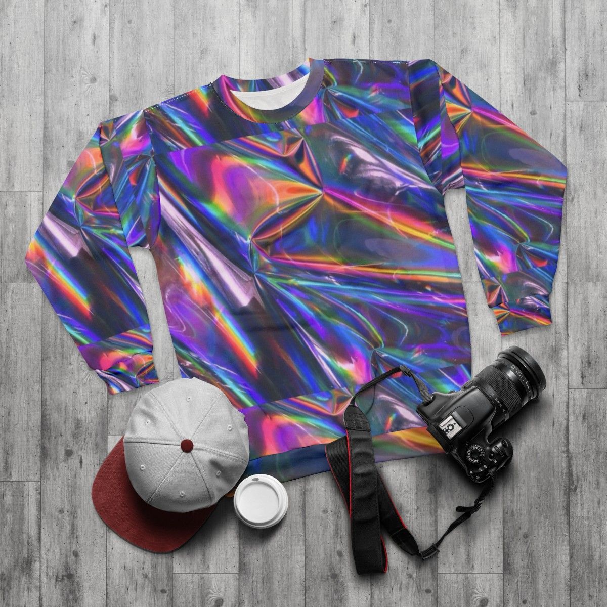 Holographic material sweatshirt with shiny, iridescent texture - flat lay