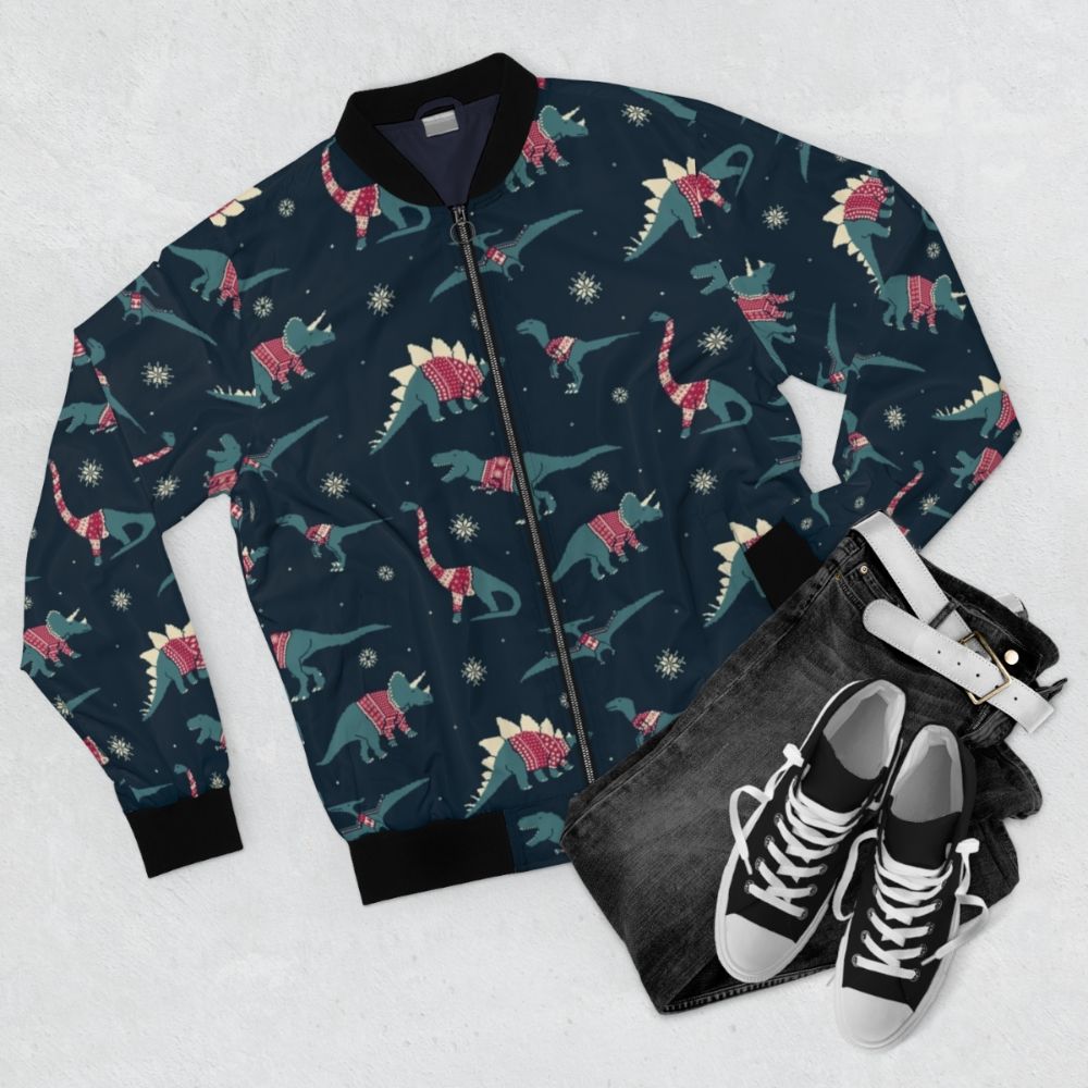 Dino and dinosaur holiday-themed bomber jacket with a cute, pixel art design - Flat lay