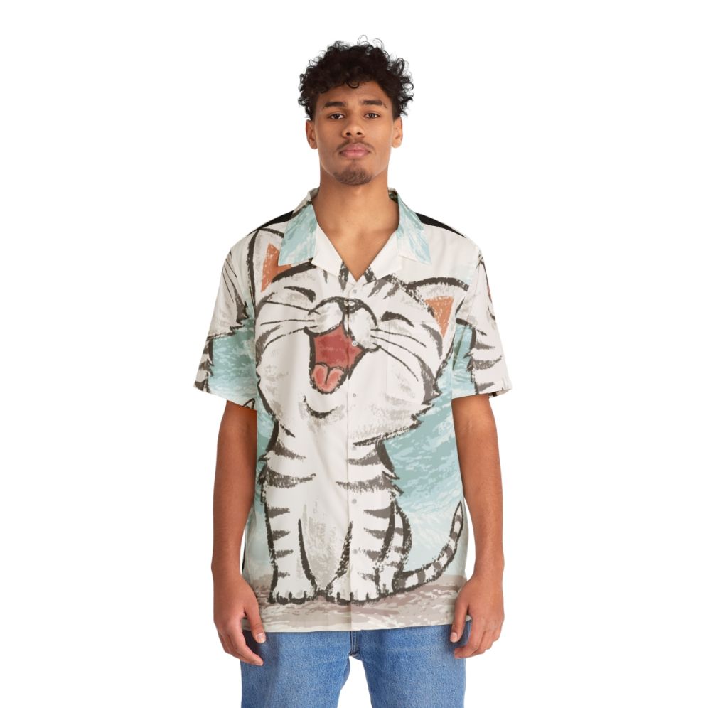 Adorable American Shorthair cat wearing a happy Hawaiian shirt - Lifestyle