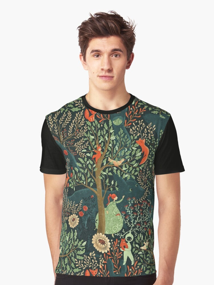 Whimsical and enchanting graphic t-shirt featuring a forest-inspired pattern with fairytale elements like a fox, trees, and floral designs in shades of green. - Men