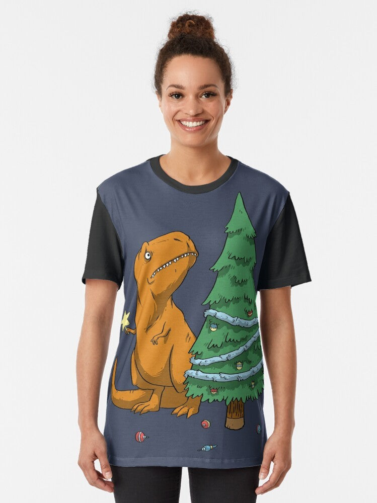 Illustration of a T-Rex dinosaur with tiny arms wearing a Christmas tree ornament on its head, surrounded by holiday decor. - Women