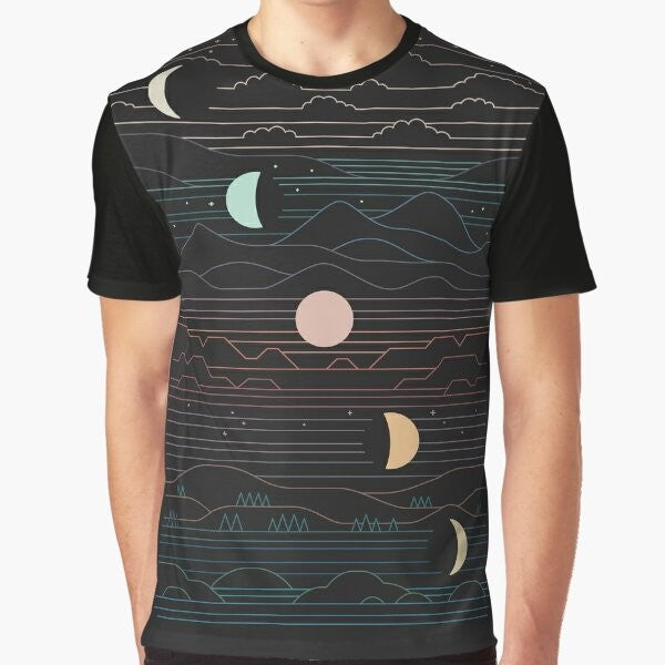 Graphic t-shirt featuring a design of a crescent moon and mountain landscape against a starry night sky