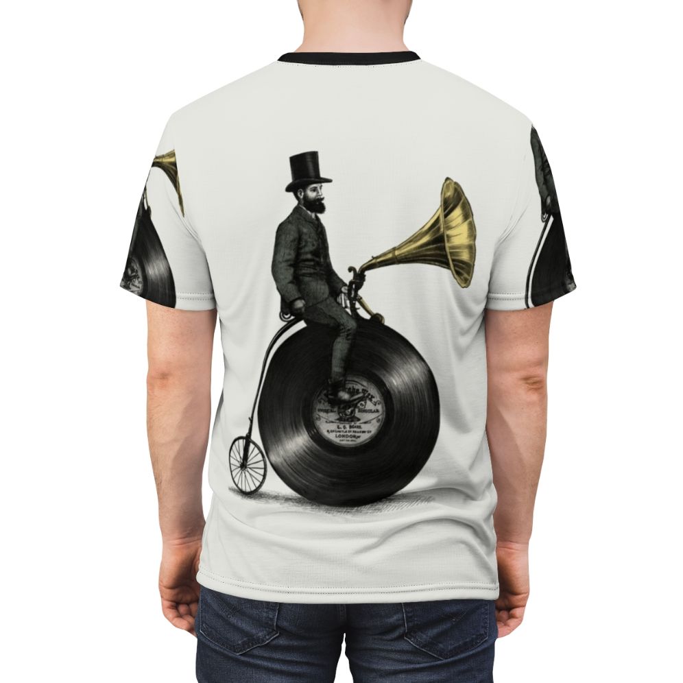 A t-shirt featuring a vintage-inspired, surreal digital illustration of a music-themed character with a top hat, mustache, and penny farthing bicycle. - men back