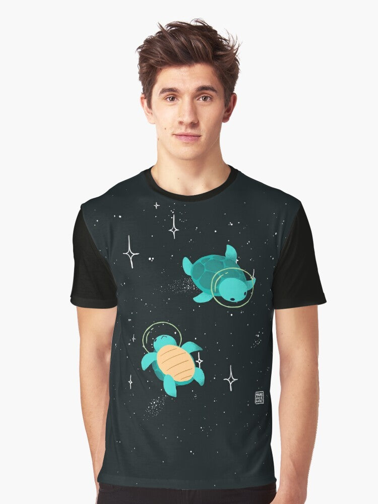 Adorable space turtle graphic design on a green t-shirt with stars and cosmic elements. - Men