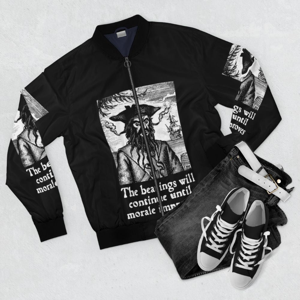 Pirate-inspired bomber jacket with the text "The Beatings Will Continue until Morale Improves" - Flat lay