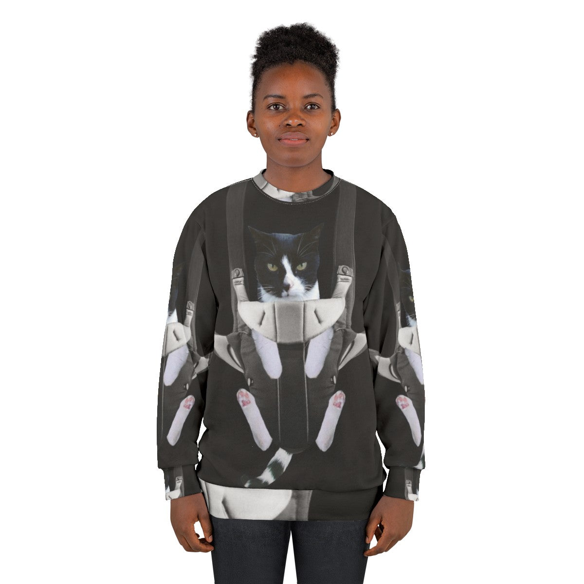 A woman wearing a sweatshirt with a cat in a baby carrier print - women