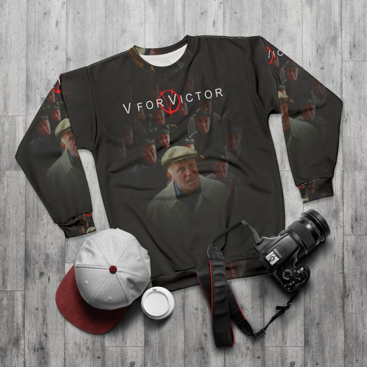 "V For Victor" graphic design on a cozy sweatshirt - flat lay