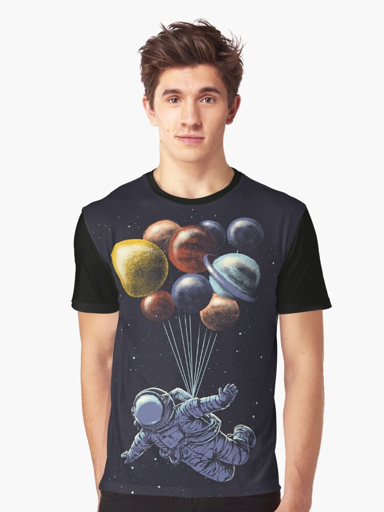 Space travel graphic t-shirt featuring a colorful, surrealist design of the solar system and cosmic elements - Men