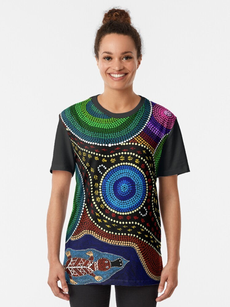 Platypus Playground Graphic T-Shirt featuring Australian Aboriginal Art with Platypus, Kangaroos, and Emus - Women