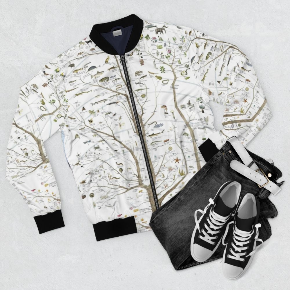 Stylish bomber jacket featuring a tree of life design with birds and dinosaurs, representing the evolution of life on Earth. - Flat lay