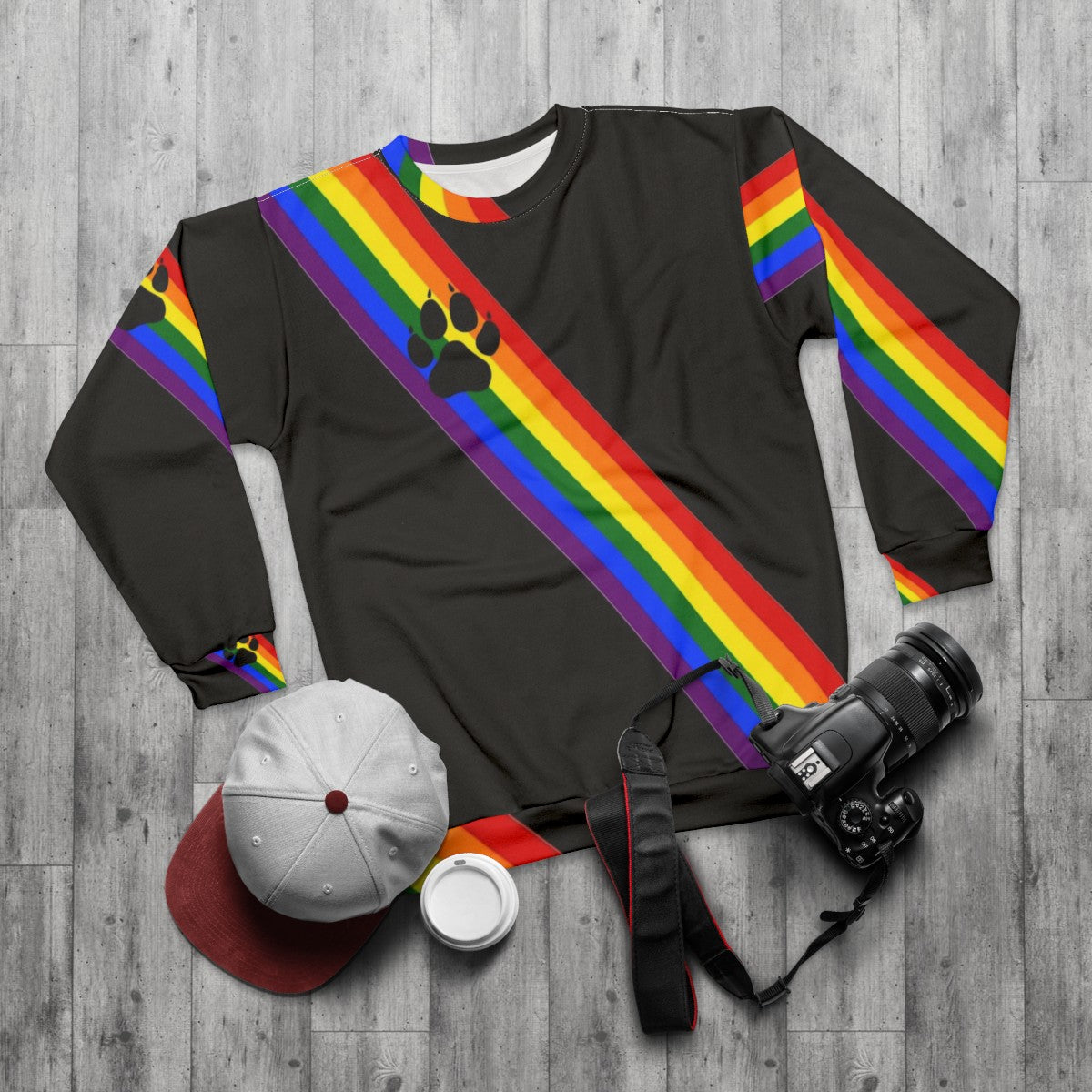 Colorful rainbow sweatshirt with puppy sash design for LGBTQ+ pride - flat lay