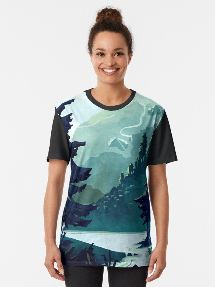 A t-shirt featuring a beautiful graphic design of the Canadian Rocky Mountains with a scenic landscape of mountains, water, and a colorful sky. - Women