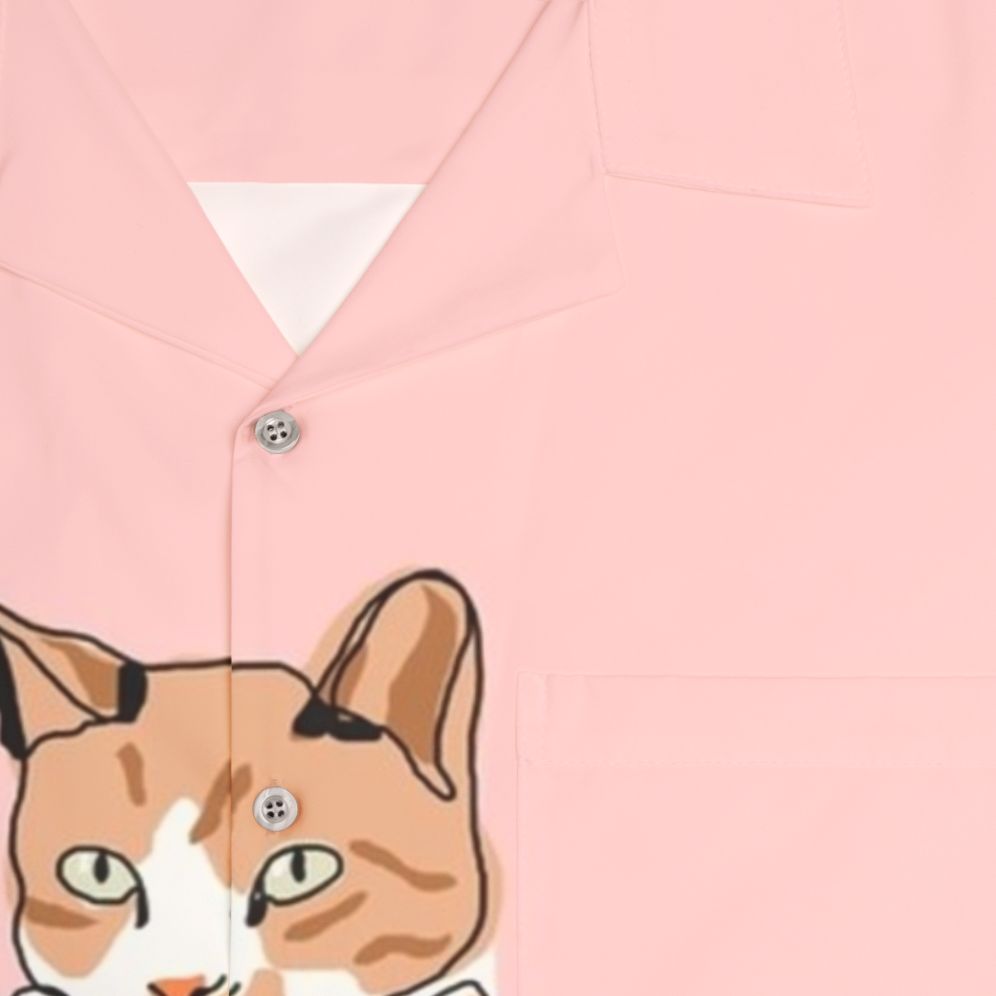 Cat wearing a colorful Hawaiian-style tropical print shirt - Detail