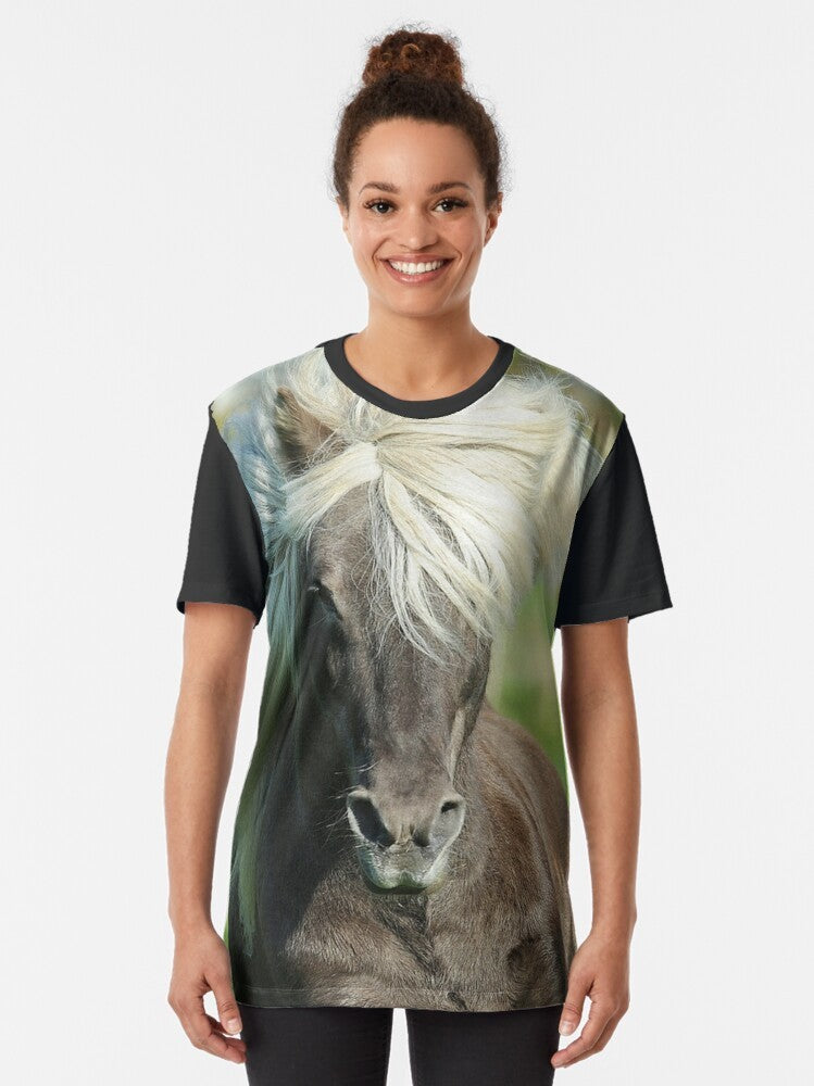 Graphic t-shirt featuring an illustration of an icelandic horse, a popular breed of pony known for its distinctive windfarben coloring. - Women