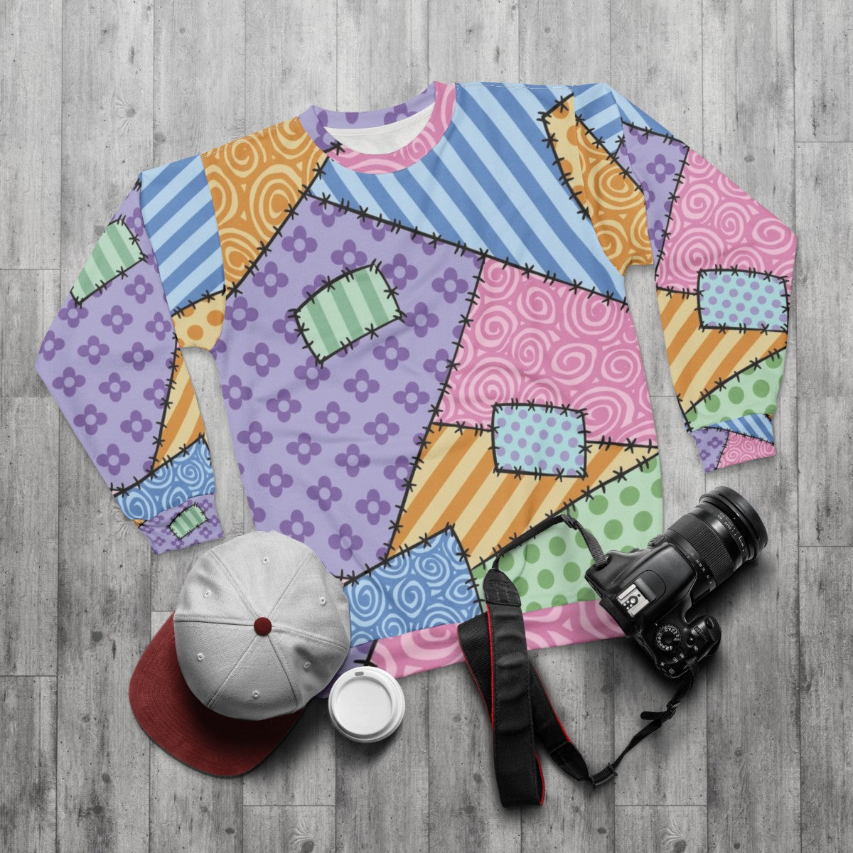 Patchwork sweatshirt with kawaii star and floral design - flat lay