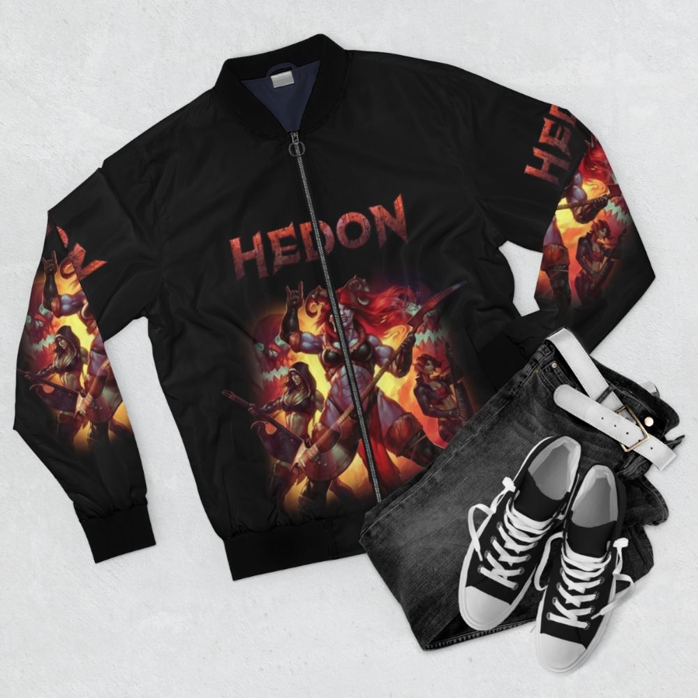 Retro fantasy HEDON bomber jacket with demon horns, featuring a striking orange and black design with skull and metal elements. - Flat lay