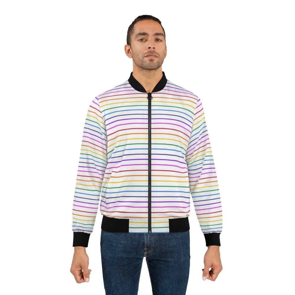 A white bomber jacket with bright horizontal rainbow stripes. - Lifestyle