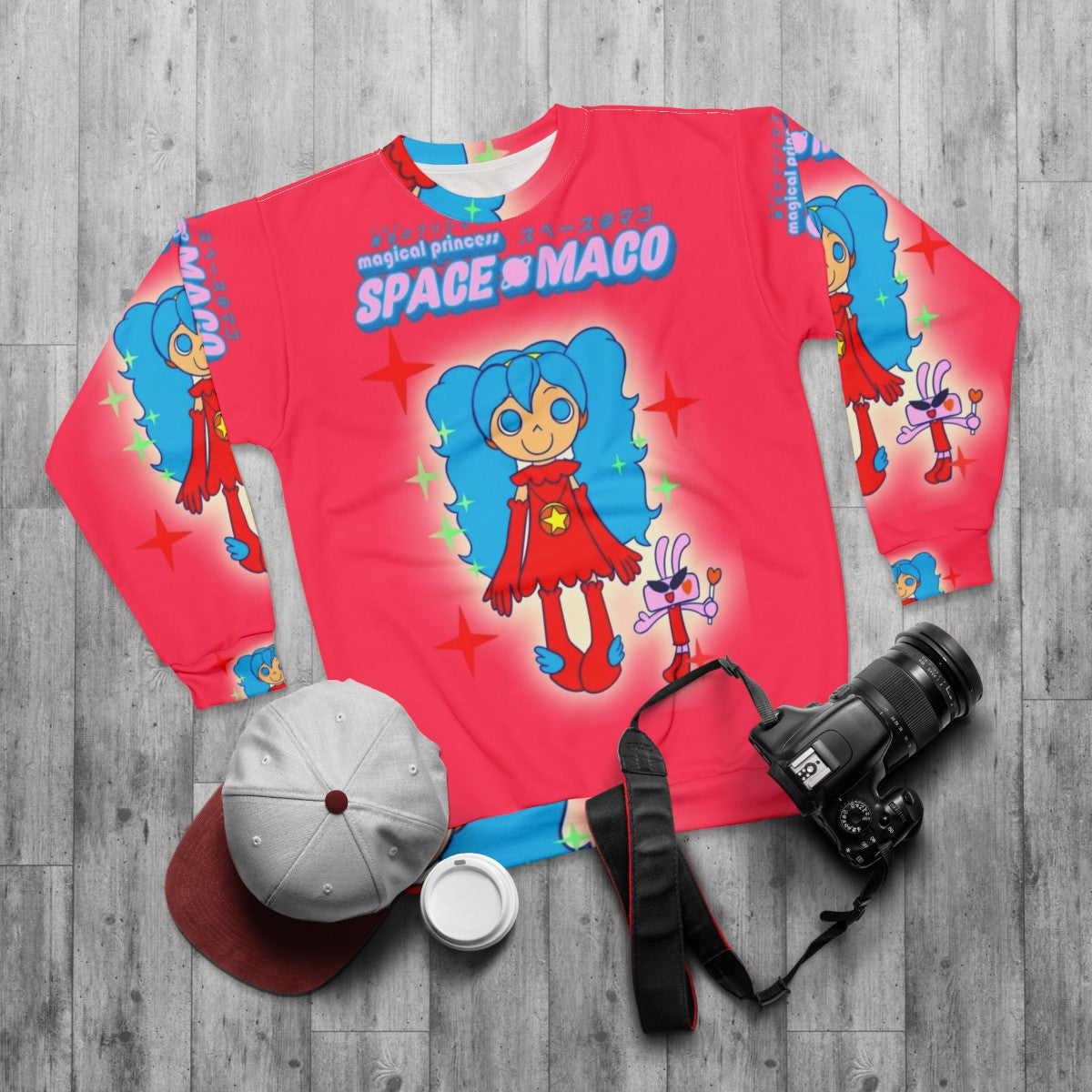 Magical pop music dance sweatshirt featuring a pink and blue space maco character - flat lay