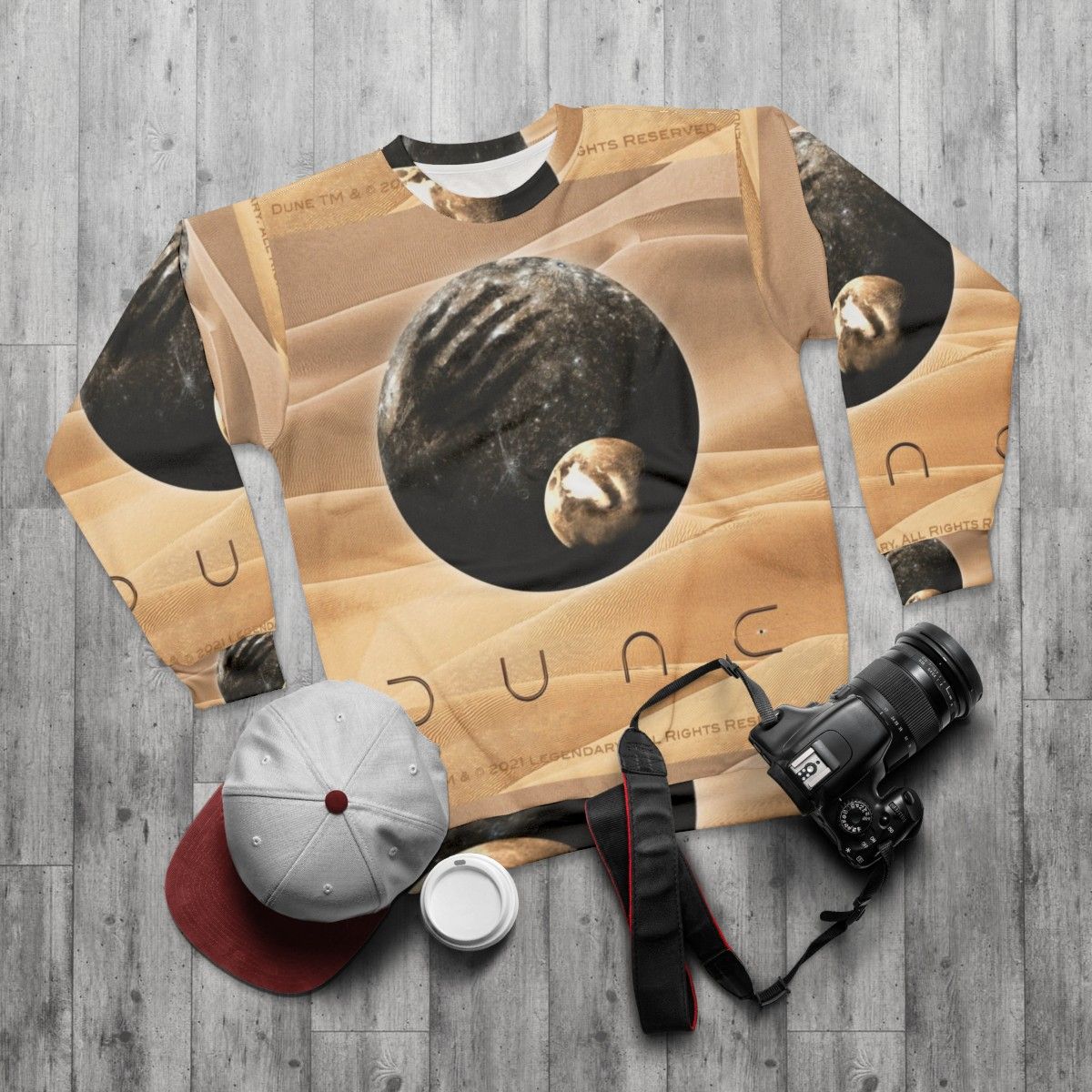 Dune-inspired cinematic sweatshirt featuring planet and moon designs - flat lay