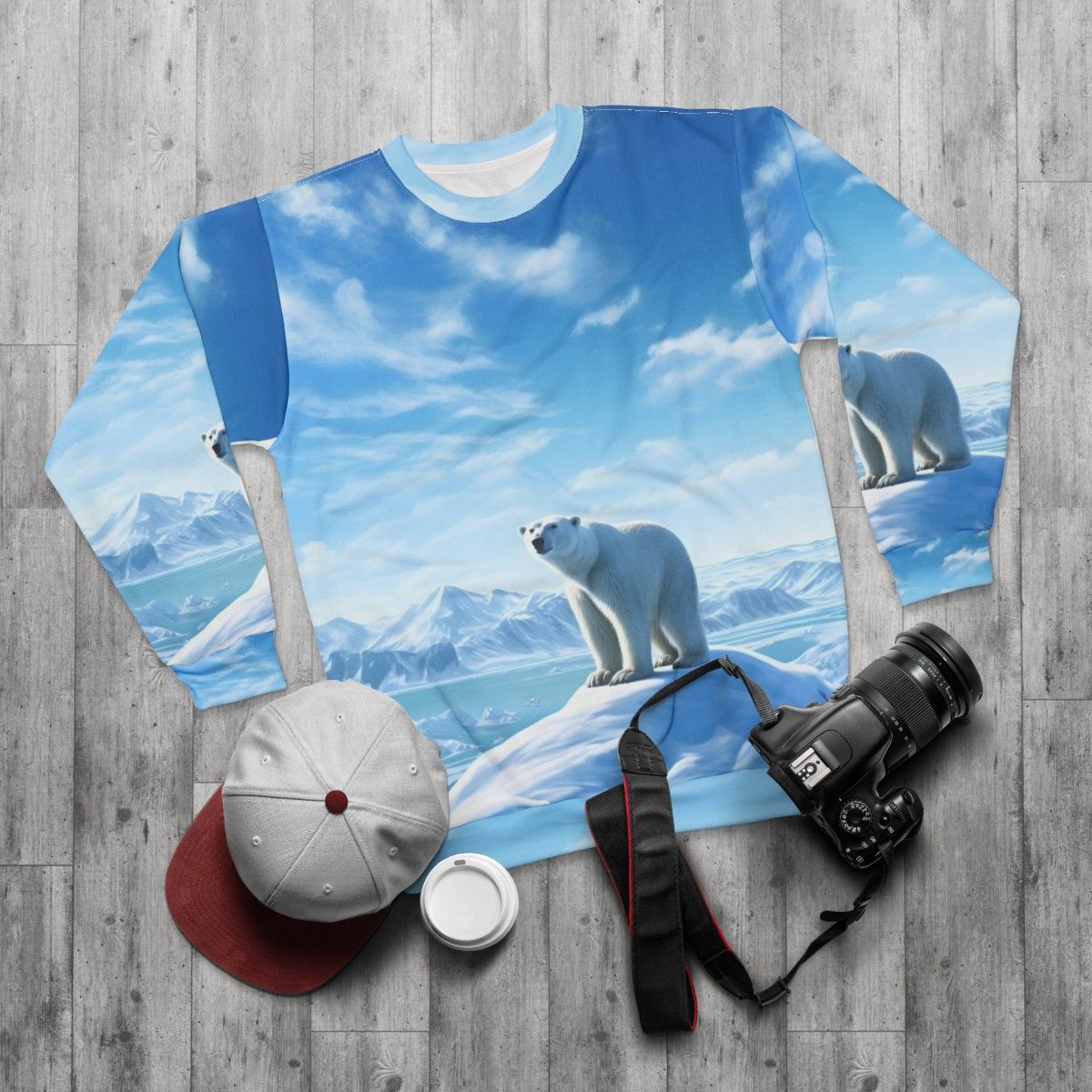 Polar bear in an arctic landscape printed on a gray sweatshirt - flat lay