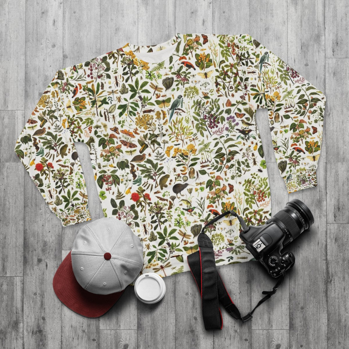 New Zealand Biology Sweatshirt featuring a repeating pattern of nature elements - flat lay