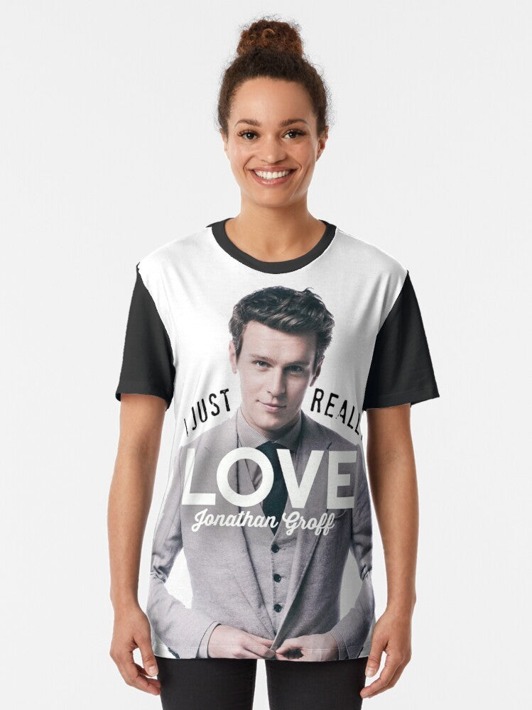 A graphic t-shirt featuring Jonathan Groff, known for his roles in Hamilton, Spring Awakening, and Glee. - Women