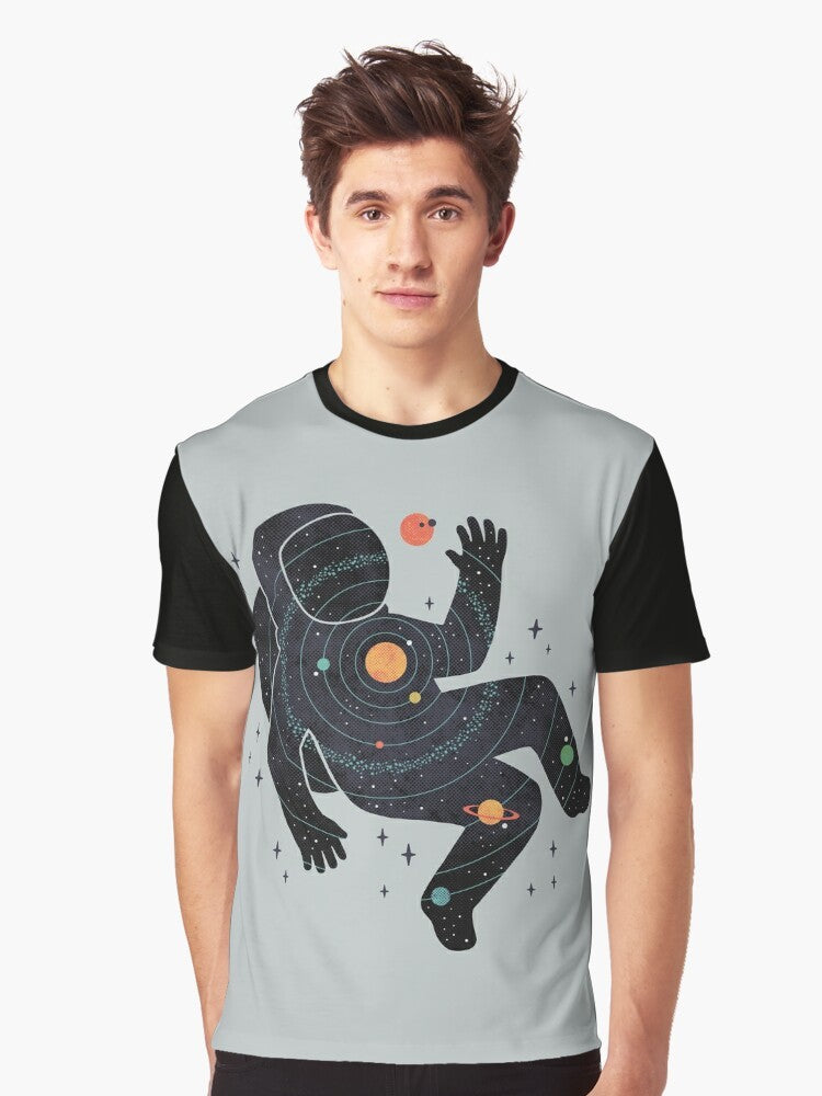 Graphic t-shirt design featuring a minimalist space and cosmos theme with an astronaut, planets, and the solar system. - Men