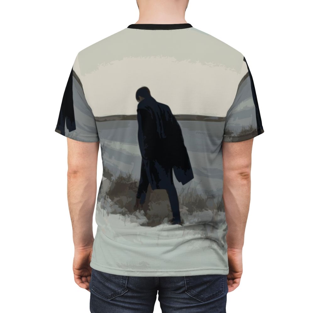 A t-shirt design featuring a minimalist figure in a coat, inspired by the emotional and introspective music of British singer-songwriter James Blake. - men back