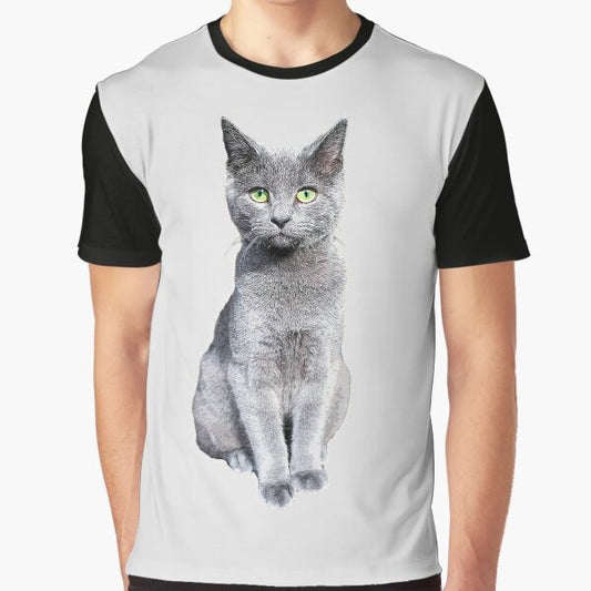 Closeup photo of a cute and fluffy Russian Blue kitten with striking green eyes on a grey graphic t-shirt.