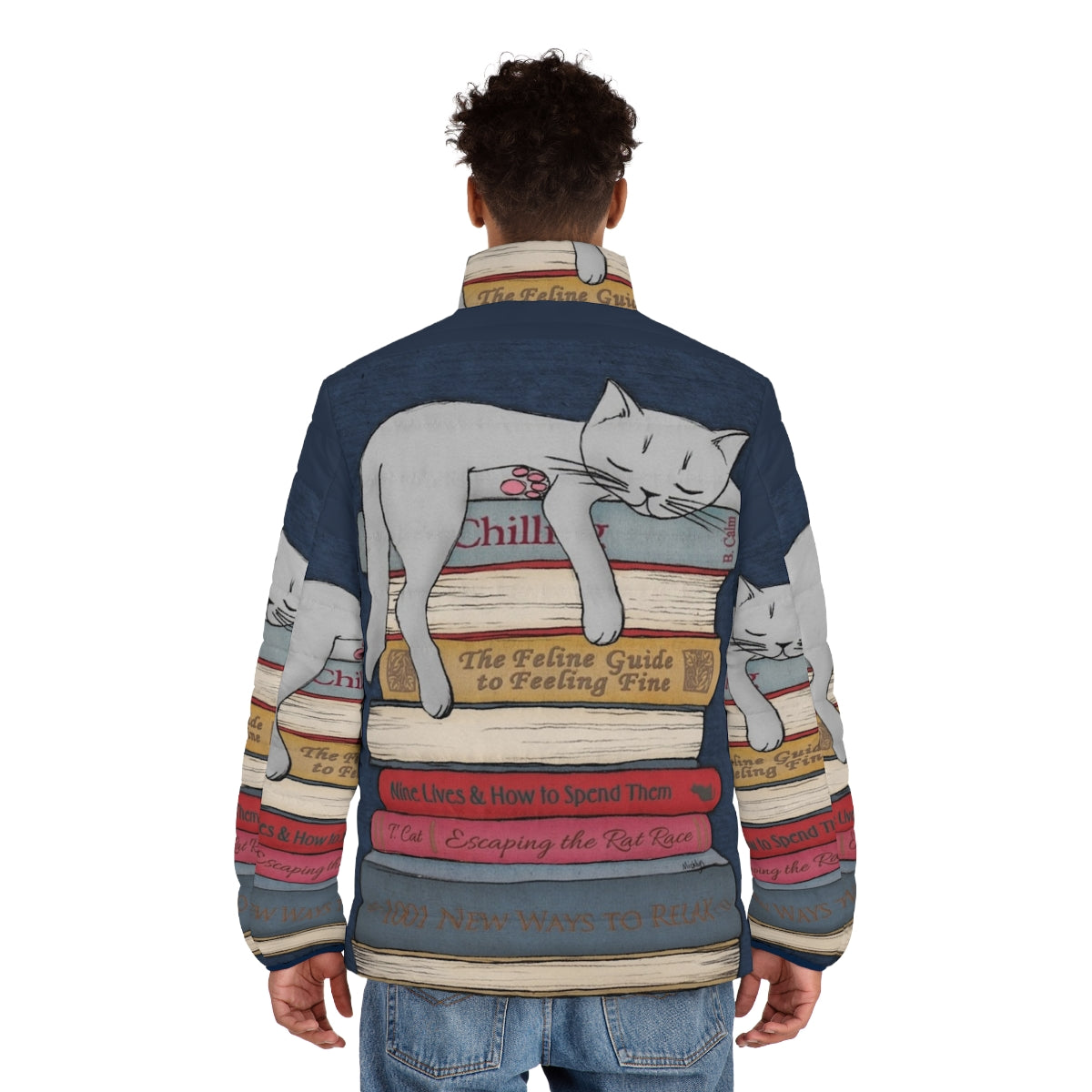 A model wearing a grey puffer jacket with a cat graphic, relaxing and napping. - men back