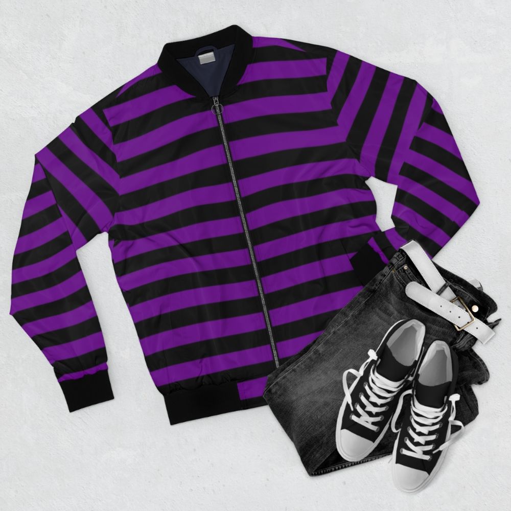 A medium-weight bomber jacket with horizontal violet and black stripes. - Flat lay